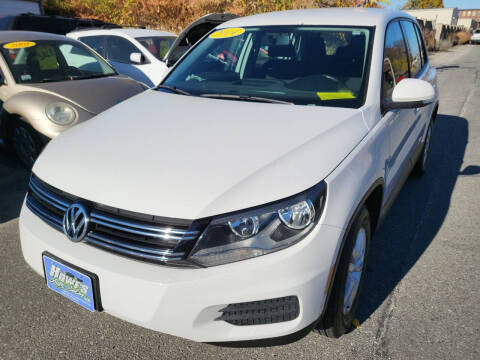 2014 Volkswagen Tiguan for sale at Howe's Auto Sales LLC - Howe's Auto Sales in Lowell MA