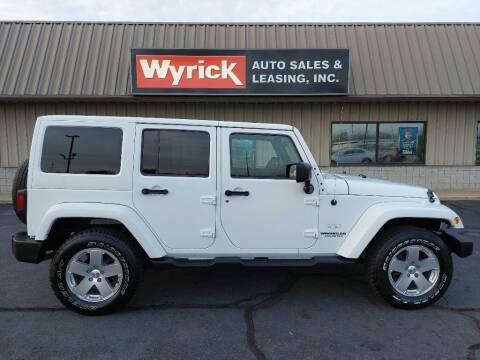 2011 Jeep Wrangler Unlimited for sale at Wyrick Auto Sales & Leasing-Holland in Holland MI