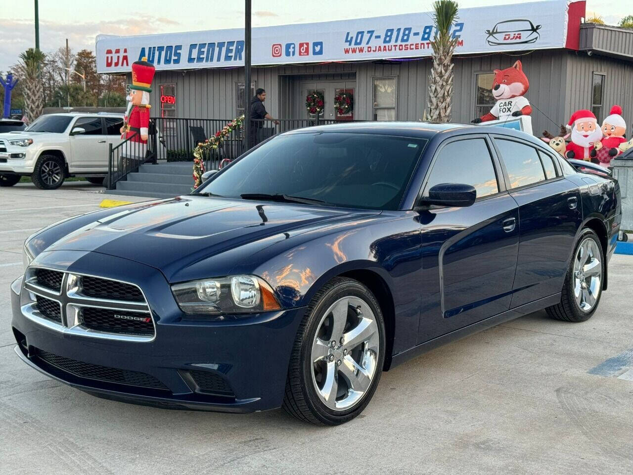 2014 Dodge Charger for sale at DJA Autos Center in Orlando, FL