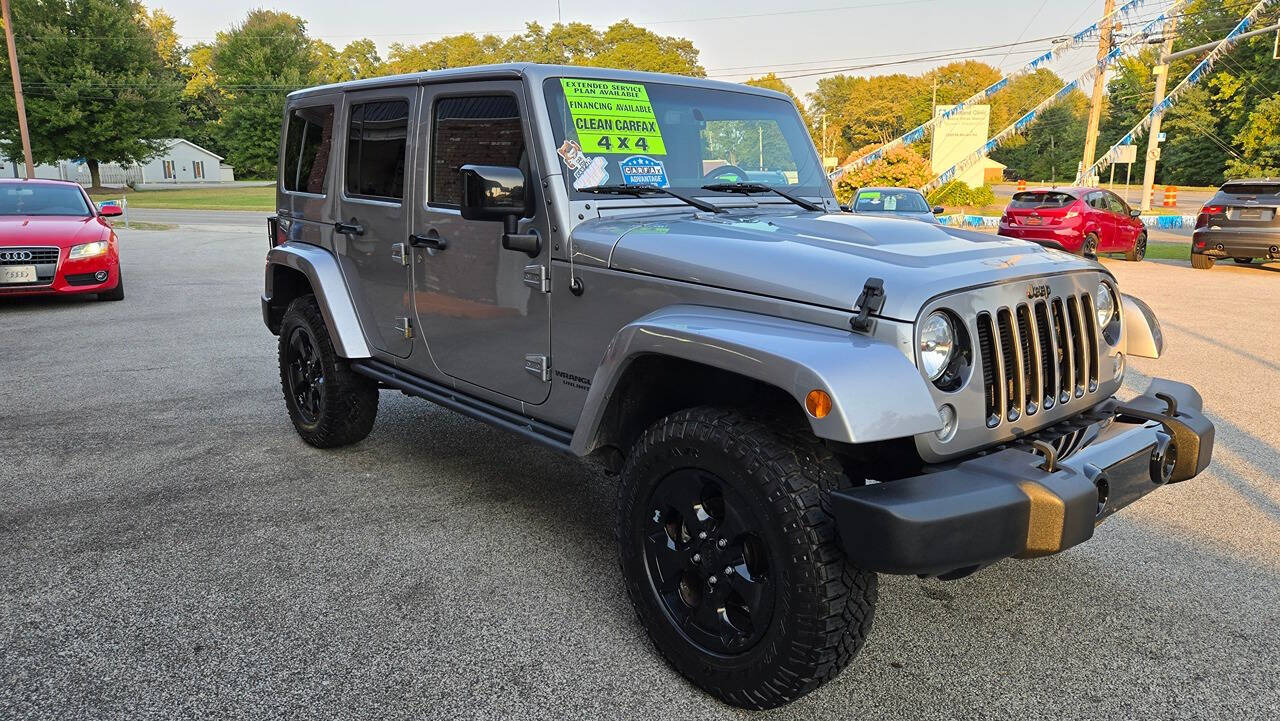 2015 Jeep Wrangler Unlimited for sale at North Ridge Auto Center LLC in Madison, OH