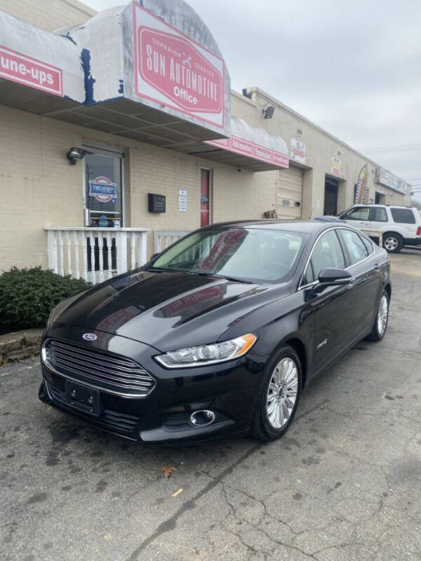 2013 Ford Fusion Hybrid for sale at SUN AUTOMOTIVE in Greensboro NC