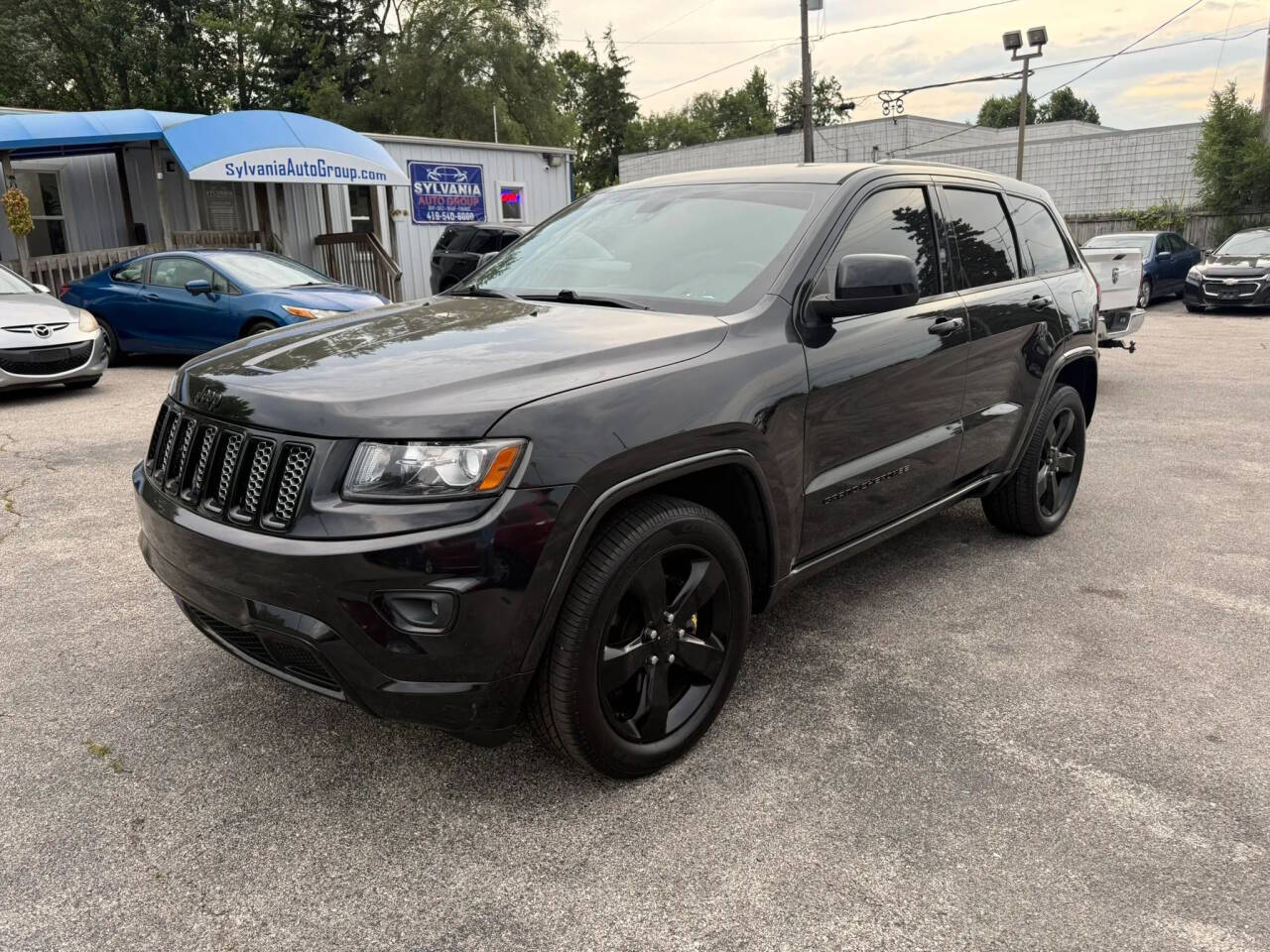 Black 2015 Jeep Grand Cherokee Altitude 4x4 Altitude 4dr SUV 1