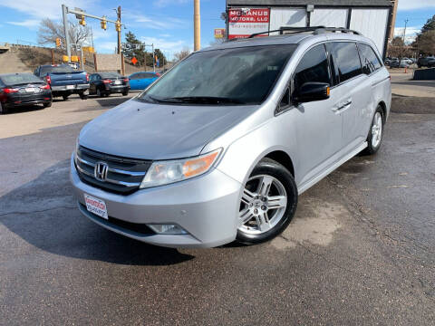2013 Honda Odyssey for sale at McManus Motors in Wheat Ridge CO
