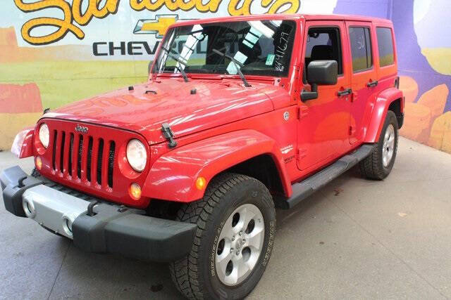 Used 2015 Jeep Wrangler Unlimited Sahara with VIN 1C4BJWEGXFL741679 for sale in Grand Ledge, MI