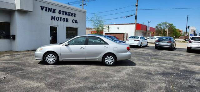 2006 Toyota Camry for sale at VINE STREET MOTOR CO in Urbana IL