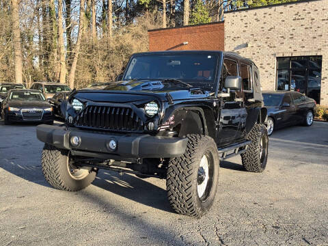 2011 Jeep Wrangler Unlimited for sale at Atlanta Unique Auto Sales in Norcross GA