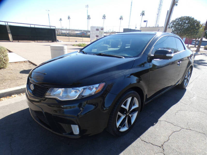 2010 Kia Forte Koup for sale at J & E Auto Sales in Phoenix AZ