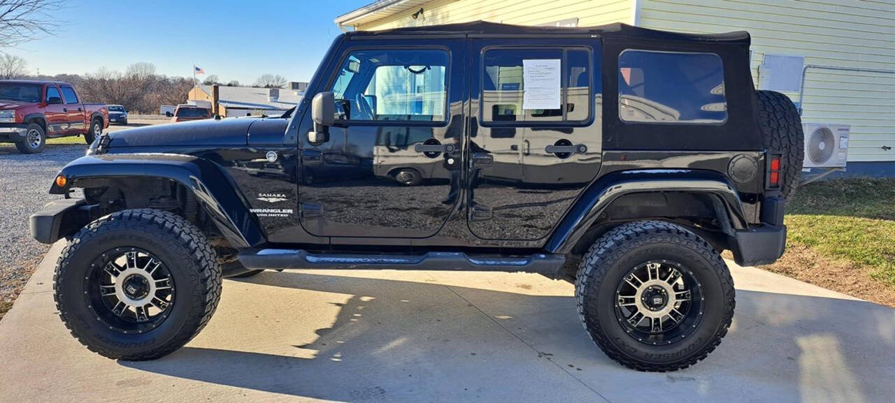 2013 Jeep Wrangler Unlimited for sale at CORNMAN AUTO LLC in Kirksville, MO