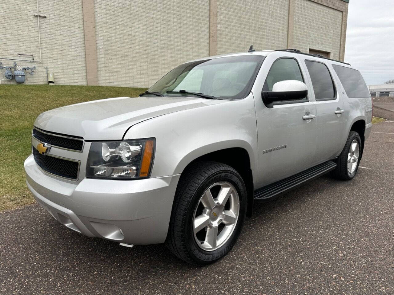 2011 Chevrolet Suburban for sale at JUST AUTOS in MINNEAPOLIS, MN