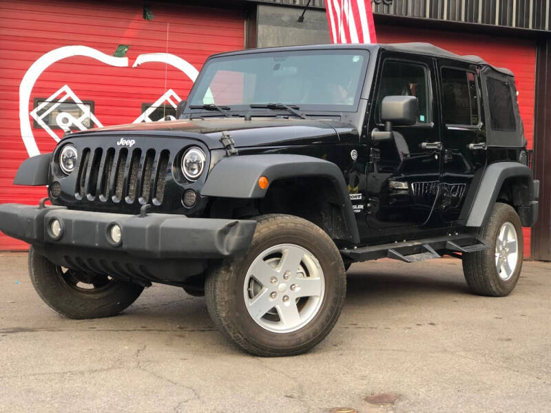 2012 Jeep Wrangler Unlimited for sale at Apple Auto Sales Inc in Camillus NY