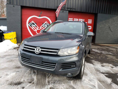 2012 Volkswagen Touareg for sale at Apple Auto Sales Inc in Camillus NY
