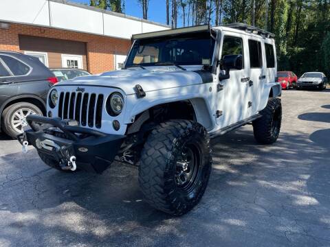 2015 Jeep Wrangler Unlimited for sale at Magic Motors Inc. in Snellville GA