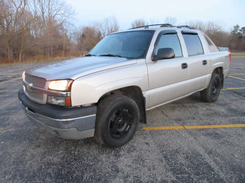 2004 Chevrolet Avalanche for sale at Caruzin Motors in Flint MI