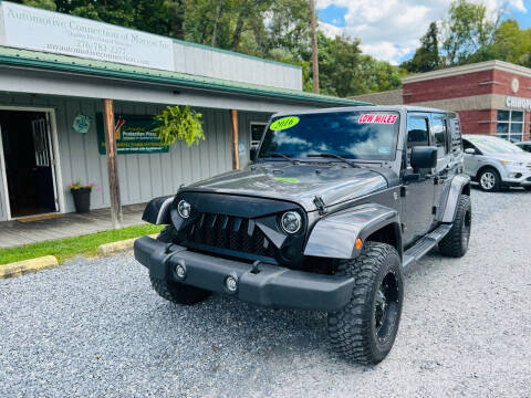 2016 Jeep Wrangler Unlimited for sale at Booher Motor Company in Marion VA