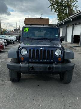 2013 Jeep Wrangler Unlimited for sale at Valley Auto Finance in Warren OH