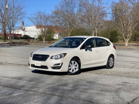 2015 Subaru Impreza for sale at Uniworld Auto Sales LLC. in Greensboro NC
