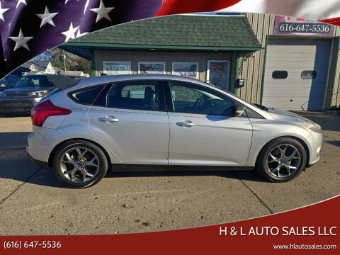 2014 Ford Focus for sale at H & L AUTO SALES LLC in Wyoming MI