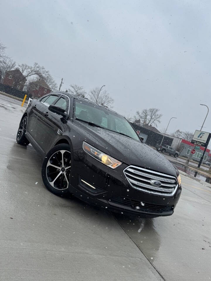 2014 Ford Taurus for sale at H & H AUTO GROUP in Detroit, MI