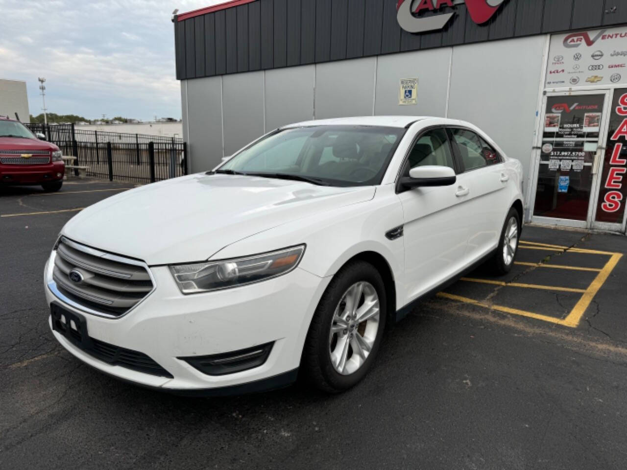 2014 Ford Taurus for sale at Carventure in Lansing, MI