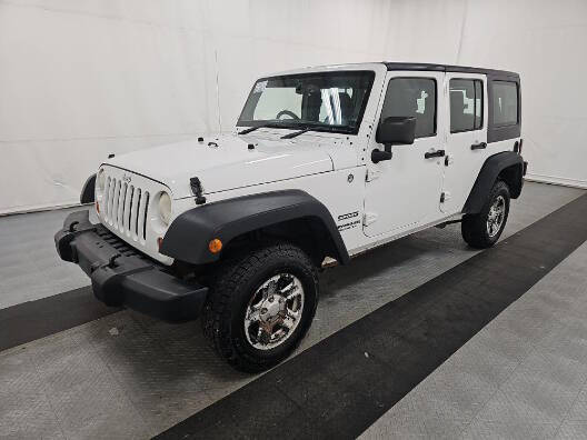 2013 Jeep Wrangler Unlimited for sale at Postal Pete in Galena IL