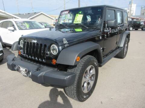 2012 Jeep Wrangler Unlimited for sale at Dam Auto Sales in Sioux City IA