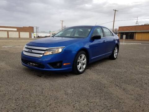 2012 Ford Fusion for sale at KHAN'S AUTO LLC in Worland WY