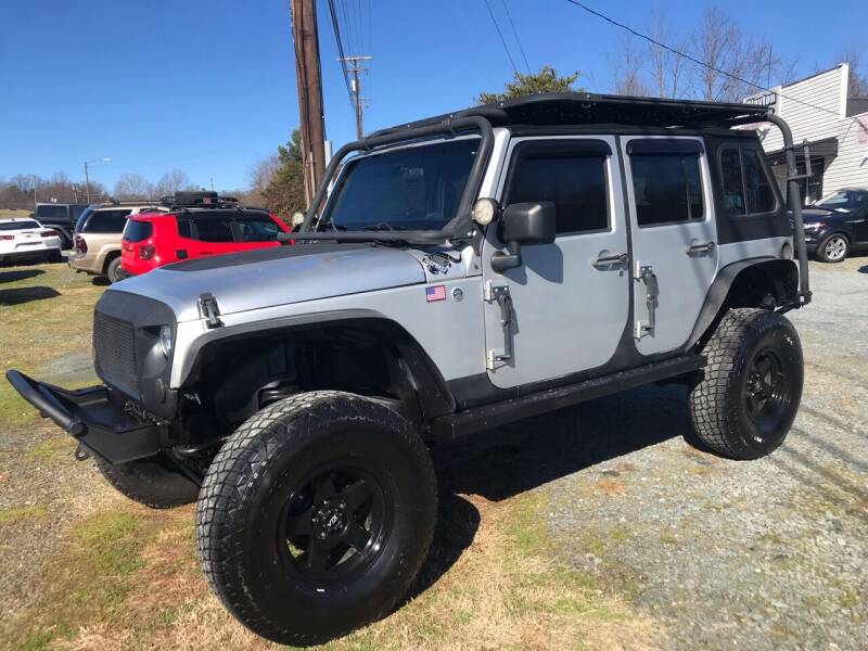2011 Jeep Wrangler Unlimited for sale at Clayton Auto Sales in Winston-Salem NC