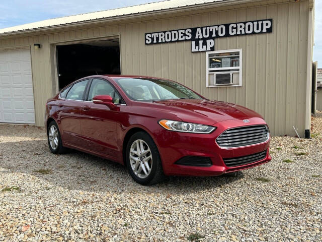 2014 Ford Fusion for sale at STRODES AUTO GROUP LLP in Malta, OH