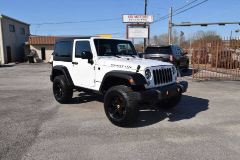 2014 Jeep Wrangler for sale at ARI Motors in Houston TX