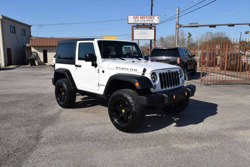 2014 Jeep Wrangler for sale at ARI Motors in Houston TX
