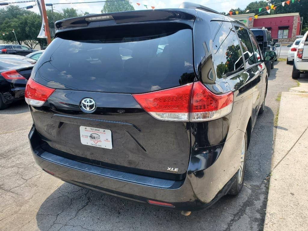 2013 Toyota Sienna for sale at DAGO'S AUTO SALES LLC in Dalton, GA