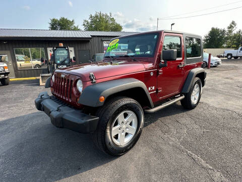 2009 Jeep Wrangler for sale at VILLAGE AUTO MART LLC in Portage IN