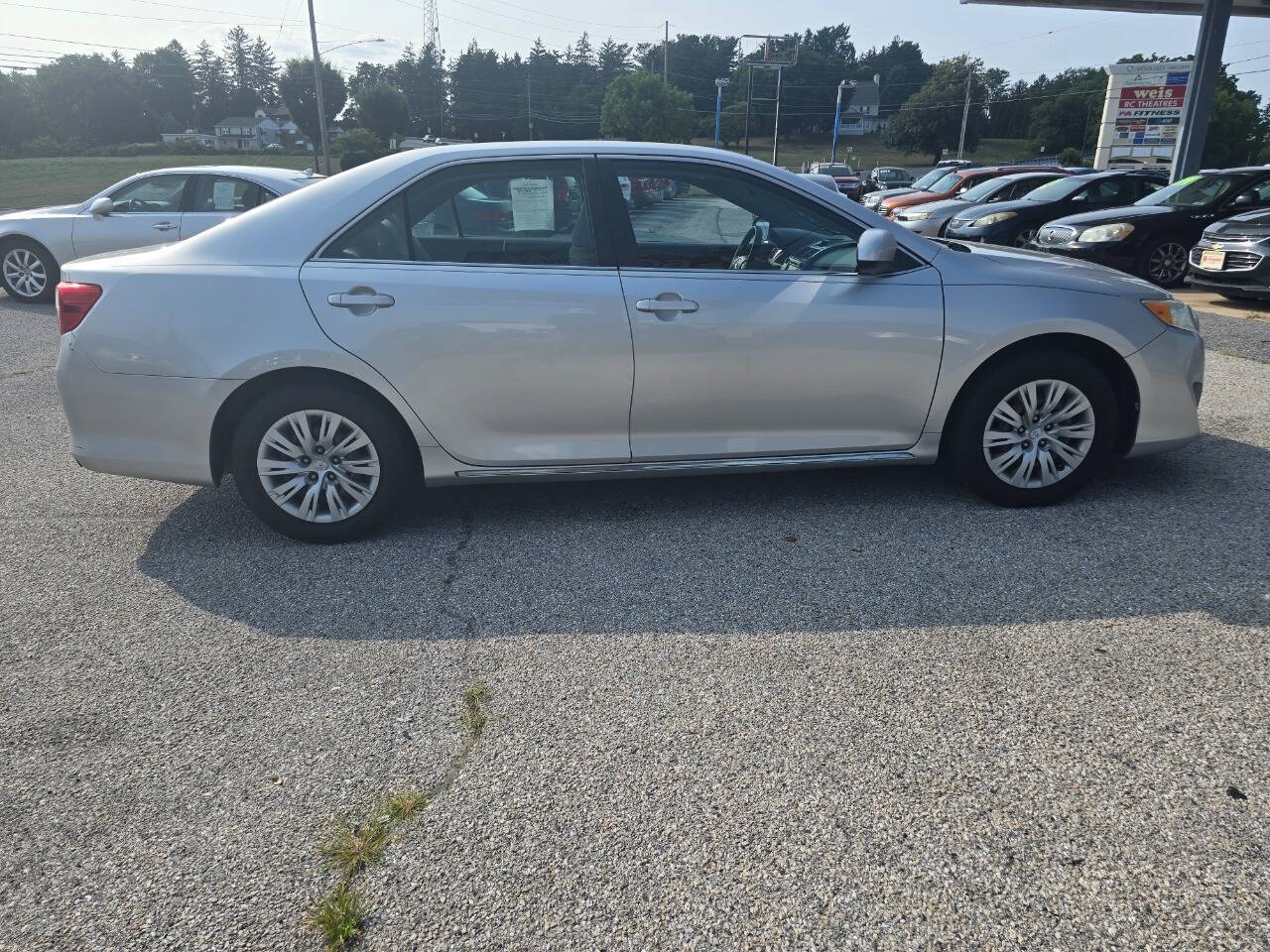 2012 Toyota Camry for sale at QUEENSGATE AUTO SALES in York, PA