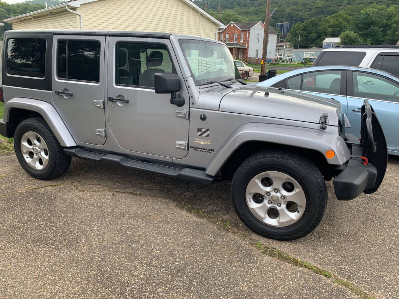 2013 Jeep Wrangler Unlimited for sale at MYERS PRE OWNED AUTOS & POWERSPORTS in Paden City WV