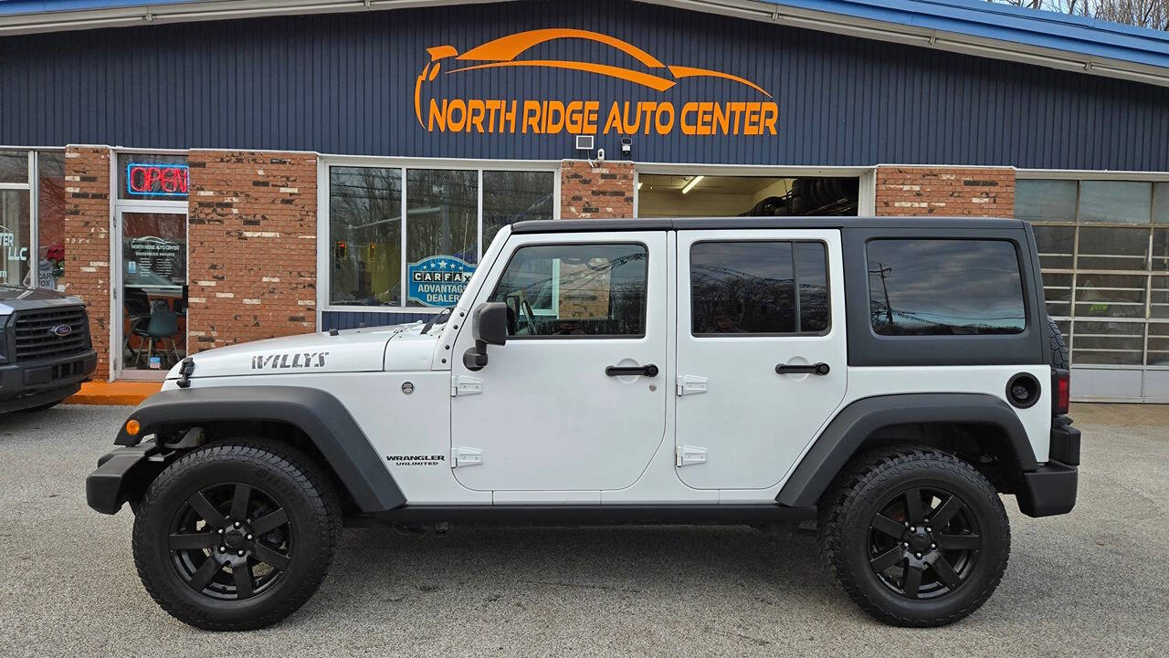 2017 Jeep Wrangler Unlimited for sale at North Ridge Auto Center LLC in Madison, OH