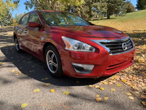 2015 Nissan Altima for sale at BELOW BOOK AUTO SALES in Idaho Falls ID