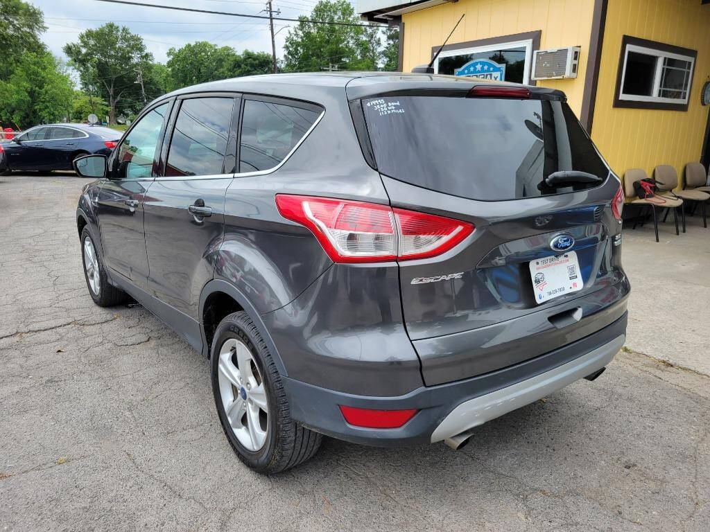 2015 Ford Escape for sale at DAGO'S AUTO SALES LLC in Dalton, GA