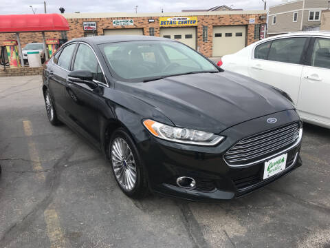 2014 Ford Fusion for sale at Carney Auto Sales in Austin MN