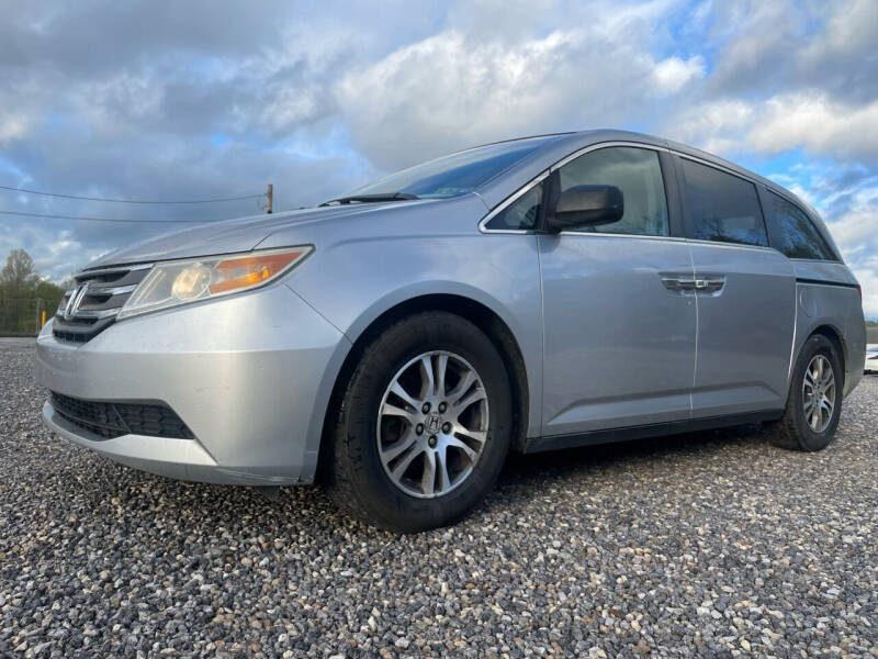2011 Honda Odyssey for sale at Jim's Hometown Auto Sales LLC in Cambridge OH