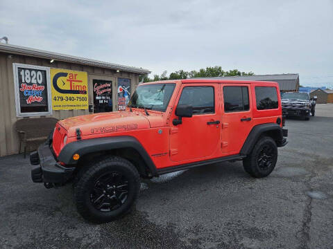 2013 Jeep Wrangler Unlimited for sale at CarTime in Rogers AR