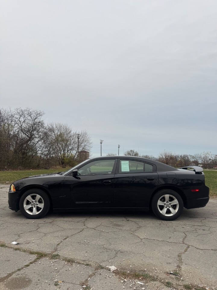 2012 Dodge Charger for sale at H & H AUTO GROUP in Detroit, MI