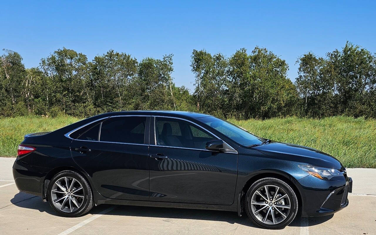 2015 Toyota Camry for sale at CAR MARKET AUTO GROUP in Sugar Land, TX