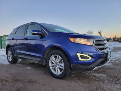2015 Ford Edge for sale at BERKENKOTTER MOTORS in Brighton CO