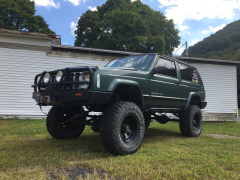 green lifted jeep cherokee