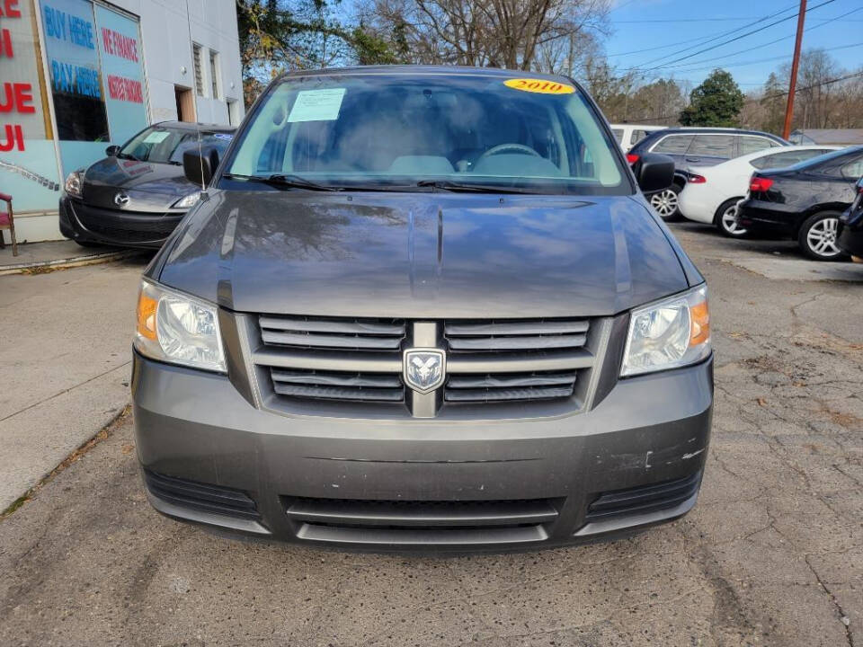 2010 Dodge Grand Caravan for sale at DAGO'S AUTO SALES LLC in Dalton, GA