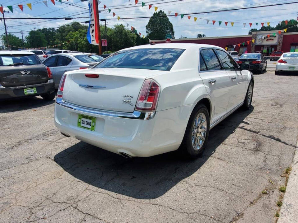 2014 Chrysler 300 for sale at DAGO'S AUTO SALES LLC in Dalton, GA