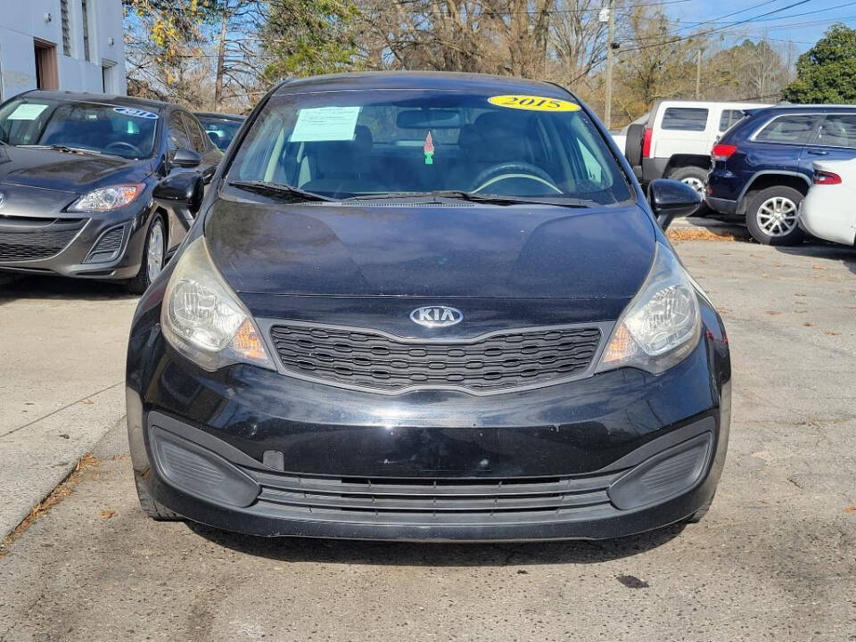 2015 Kia Rio for sale at DAGO'S AUTO SALES LLC in Dalton, GA