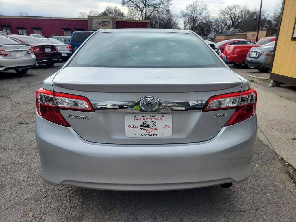 2012 Toyota Camry for sale at DAGO'S AUTO SALES LLC in Dalton, GA