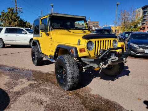 2002 Jeep Wrangler for sale at BERKENKOTTER MOTORS in Brighton CO