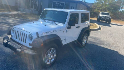 2014 Jeep Wrangler for sale at AMG Automotive Group in Cumming GA